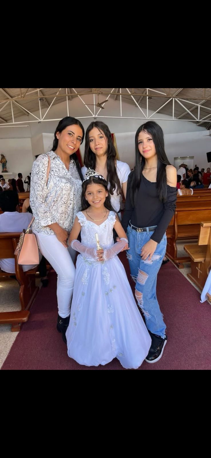 Catholic church interior with girl in white dress